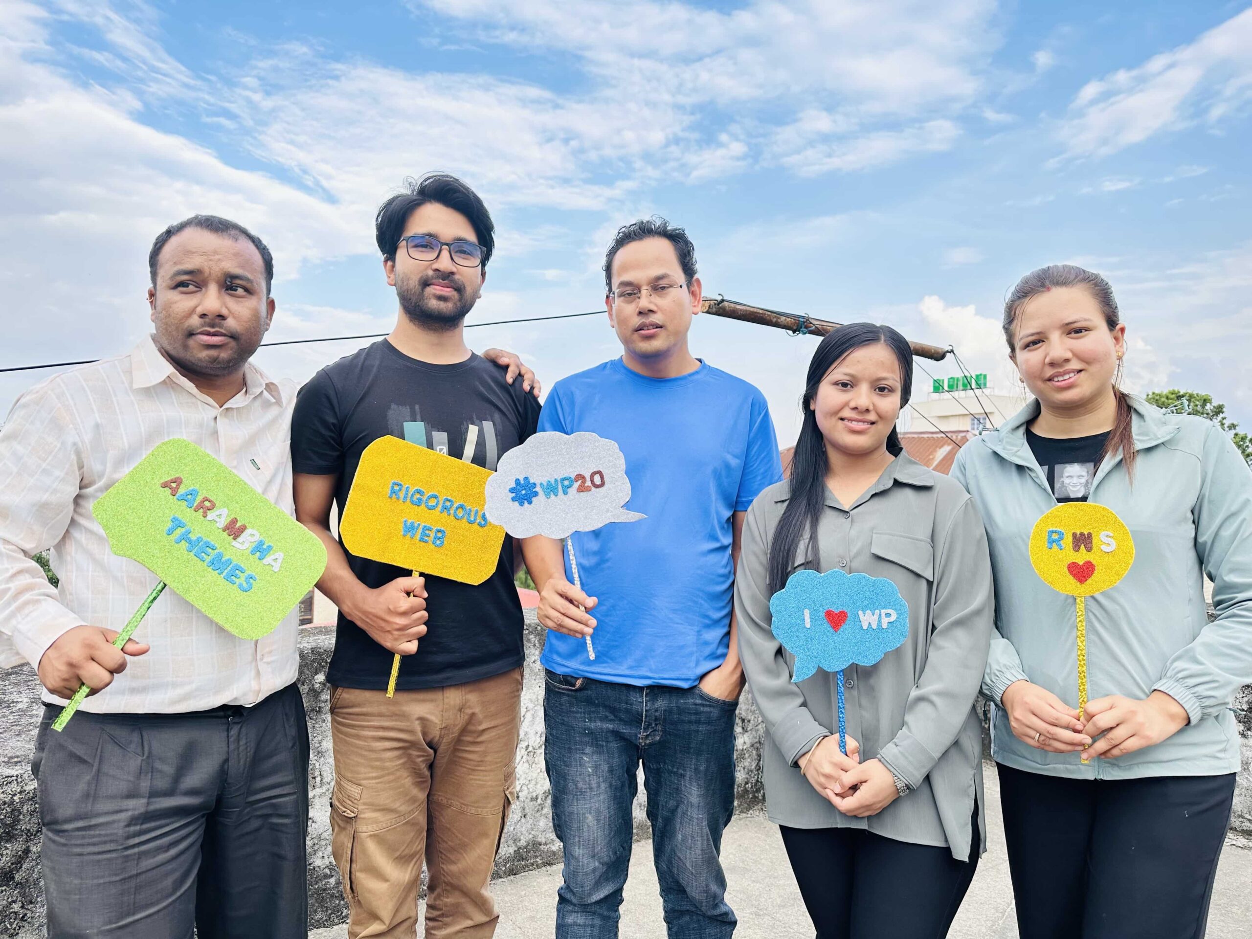 Employeess with CEO of RWS taking photos in 20th WordPress Anniversary